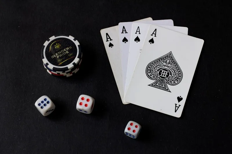 number of joker playing cards dice laid on a surface for gambling